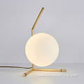Gold simple metal brackets opal glass table lights
